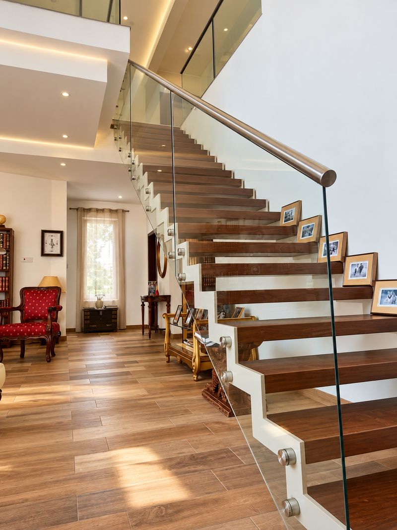Timber cantilevered staircase with frameless glass balustrade